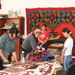 Bokonbaevo village Women working surrounded by ancient patterns