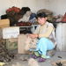 Don Aryk village, Tokmak Girl plucking rough wool